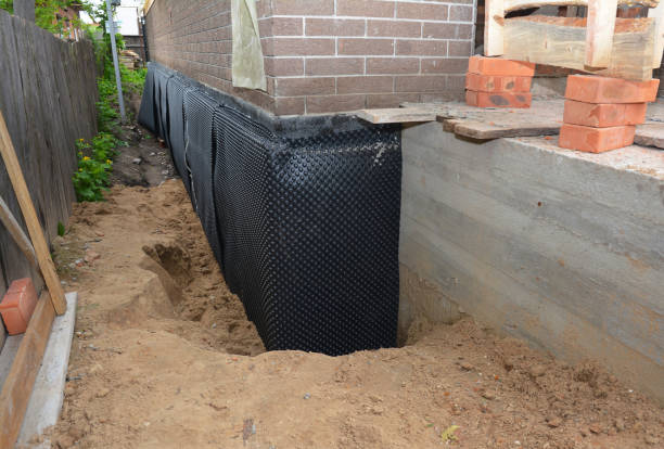 Happy homeowners after waterproofing job in Millburn
